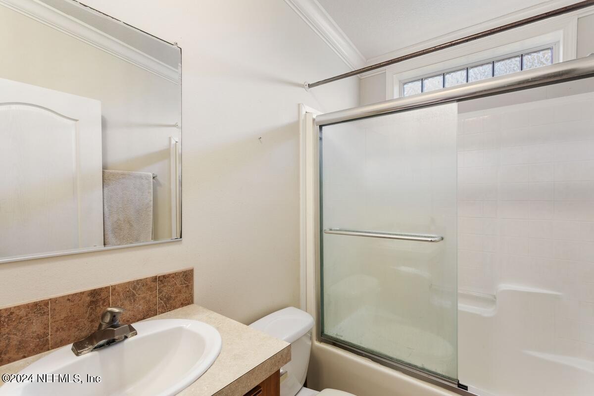 175 Hawk Lane Hastings, FL 32145 - Photo 16 of 40 a bathroom with a sink and shower