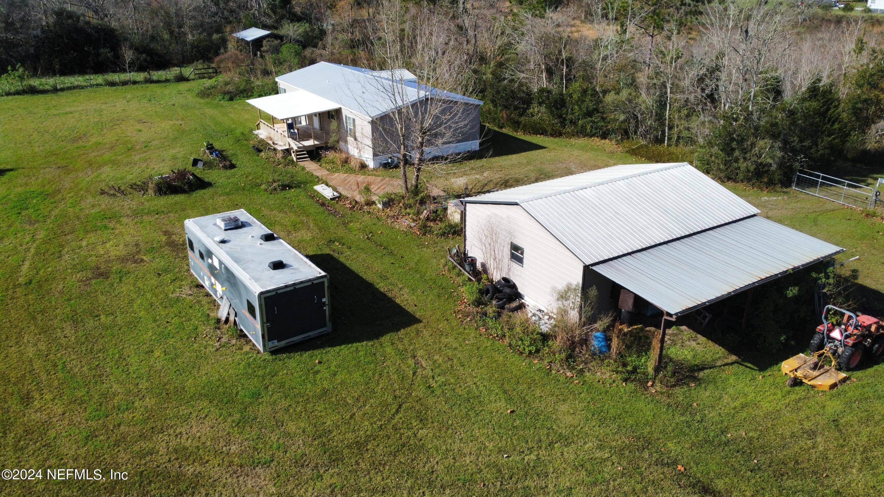 175 Hawk Lane Hastings, FL 32145 - Photo 2 of 40 a view of a house with backyard and garden