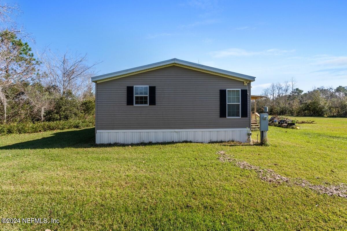 175 Hawk Lane Hastings, FL 32145 - Photo 20 of 40 a house view with a garden space
