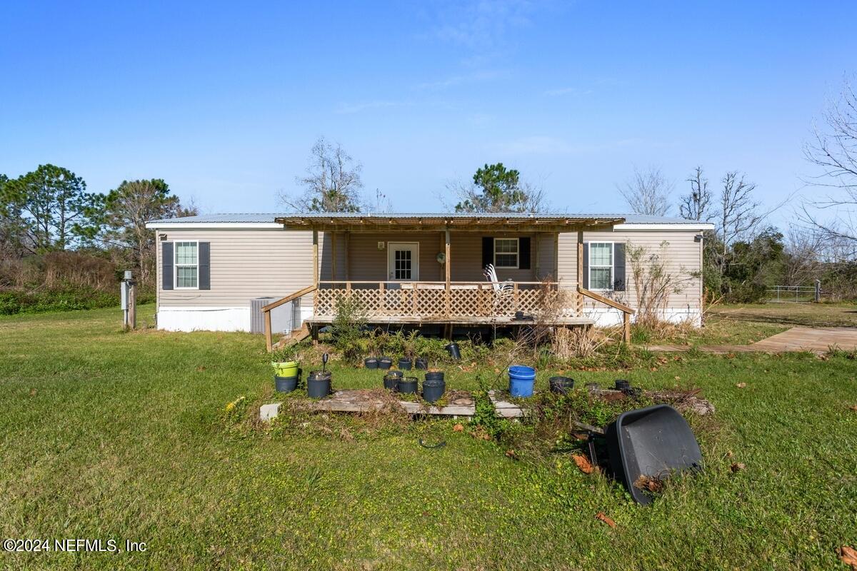 175 Hawk Lane Hastings, FL 32145 - Photo 22 of 40 a front view of house with yard