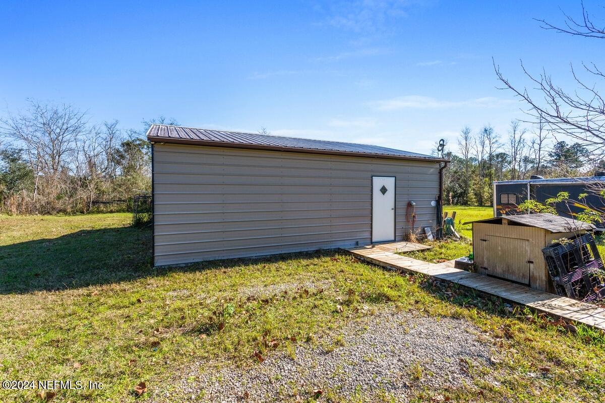 175 Hawk Lane Hastings, FL 32145 - Photo 25 of 40 a view of a backyard