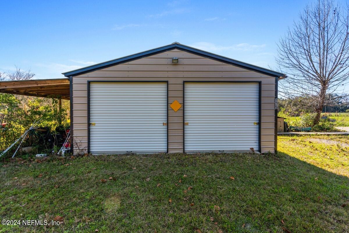 175 Hawk Lane Hastings, FL 32145 - Photo 26 of 40 a front view of house with yard and green space