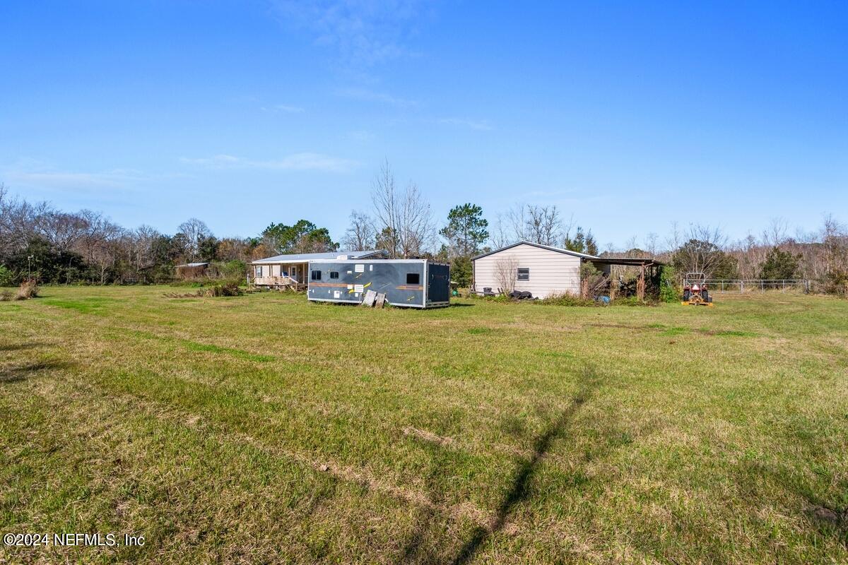 175 Hawk Lane Hastings, FL 32145 - Photo 27 of 40 a view of a field with an trees