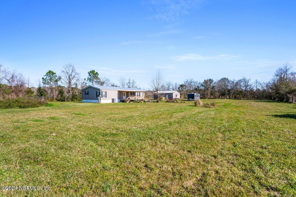 175 Hawk Lane Hastings, FL 32145 - Photo 28 of 40 a view of a lake with houses