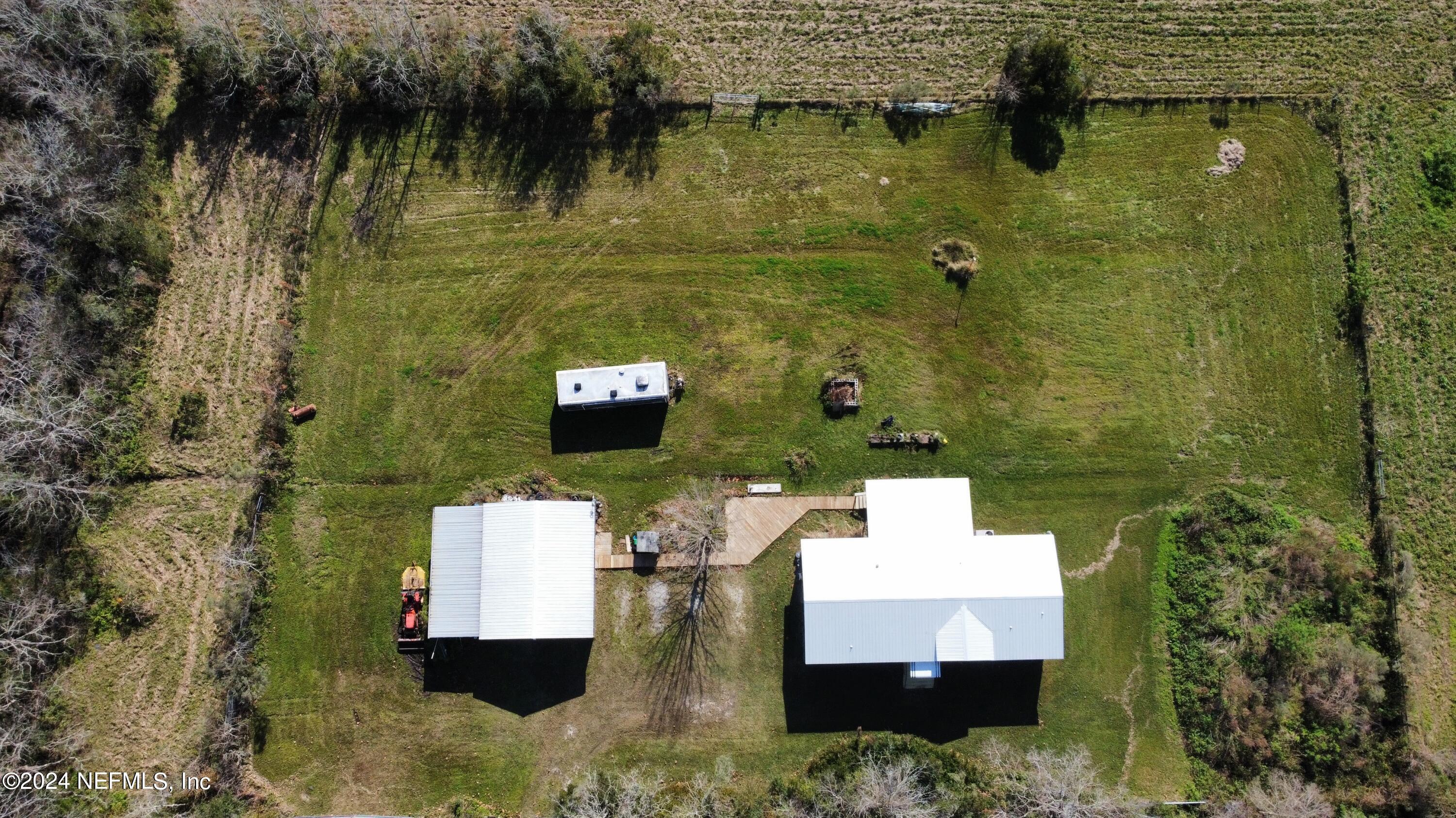 175 Hawk Lane Hastings, FL 32145 - Photo 29 of 40 an aerial view of a house with a lake view
