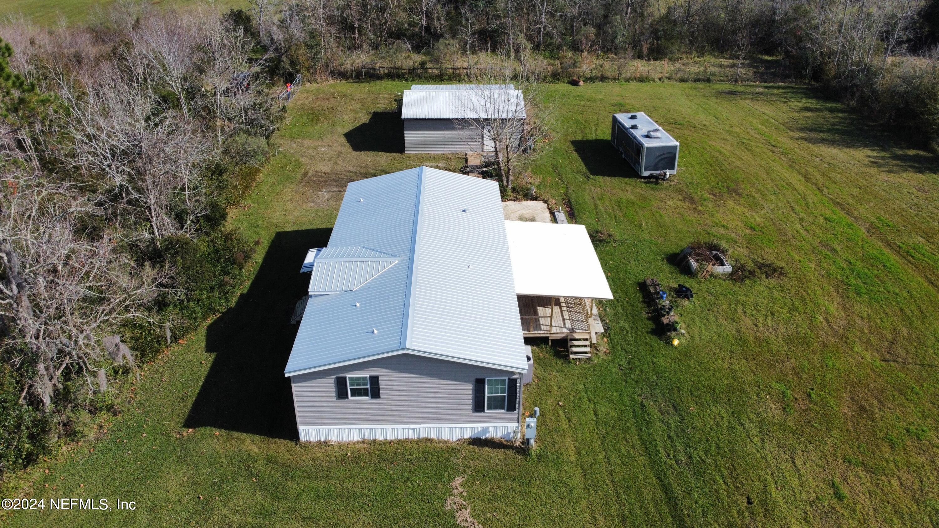175 Hawk Lane Hastings, FL 32145 - Photo 30 of 40 an aerial view of a house with a yard