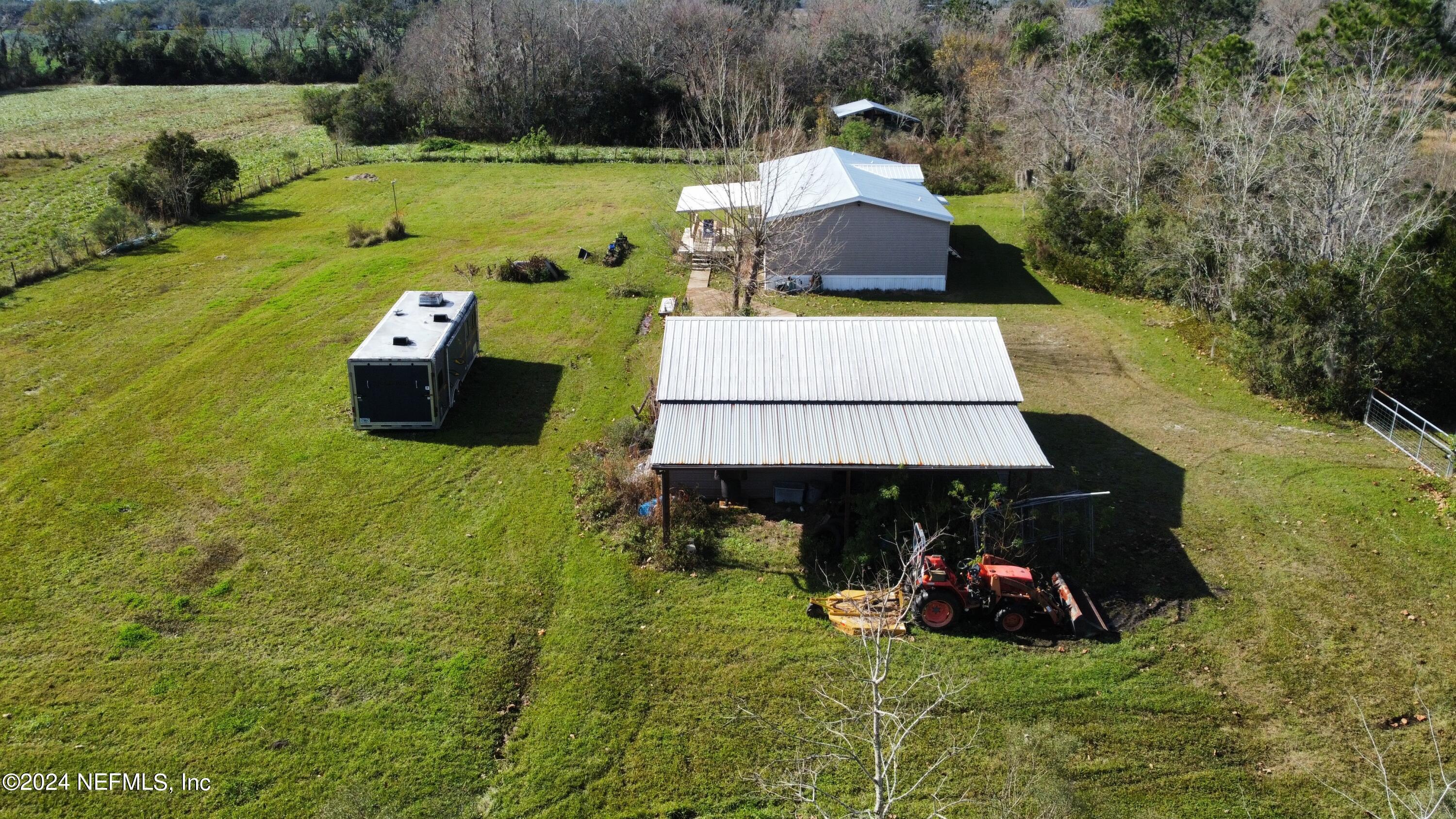 175 Hawk Lane Hastings, FL 32145 - Photo 31 of 40 a view of a back yard of the house with a swimming pool