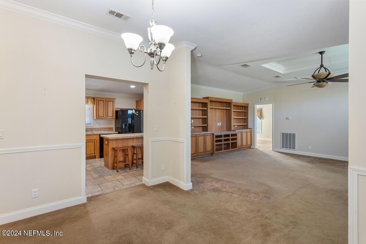 175 Hawk Lane Hastings, FL 32145 - Photo 6 of 40 a view of a livingroom with furniture and an empty room