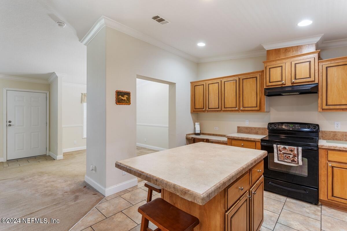 175 Hawk Lane Hastings, FL 32145 - Photo 9 of 40 a kitchen with granite countertop a stove a sink dishwasher and a refrigerator with wooden floor