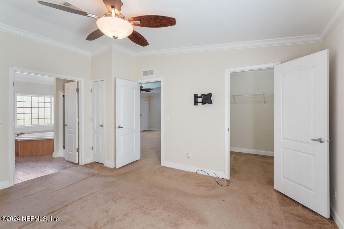 175 Hawk Lane Hastings, FL 32145 - Photo 10 of 40 wooden floor in an empty room with a window