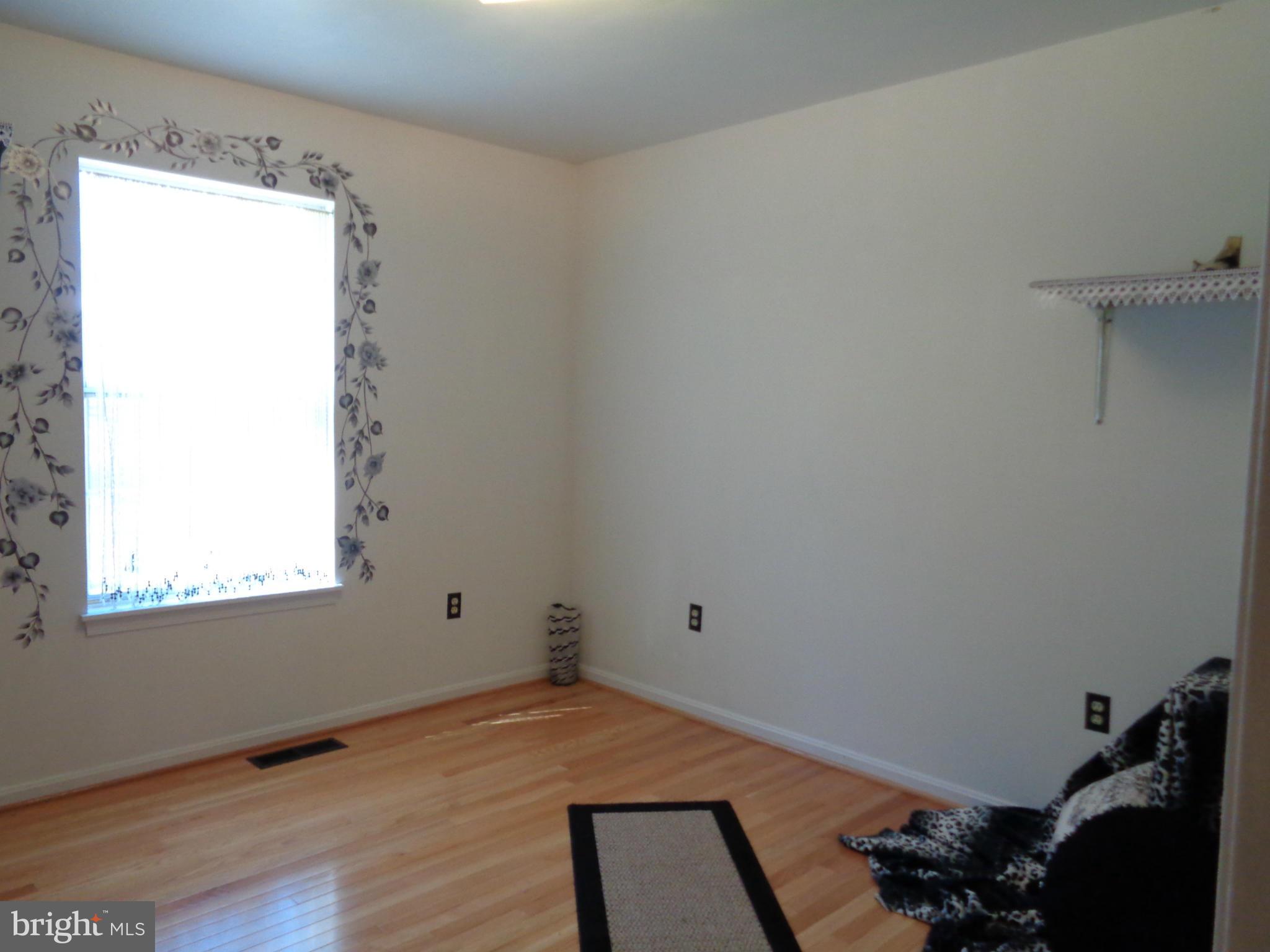 2000 Kings Landing Road Huntingtown, MD 20639 - Photo 13 of 24 a room with a window and wooden floor