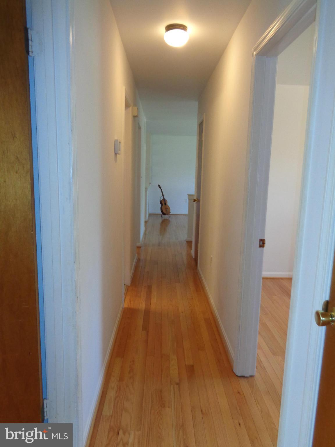 2000 Kings Landing Road Huntingtown, MD 20639 - Photo 8 of 24 a view of a hallway with wooden floor