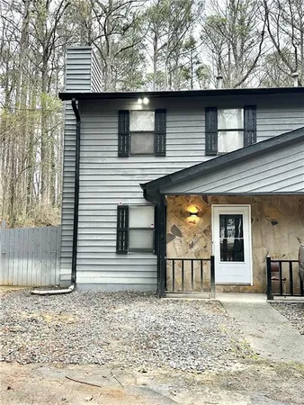 a front view of a house with large windows