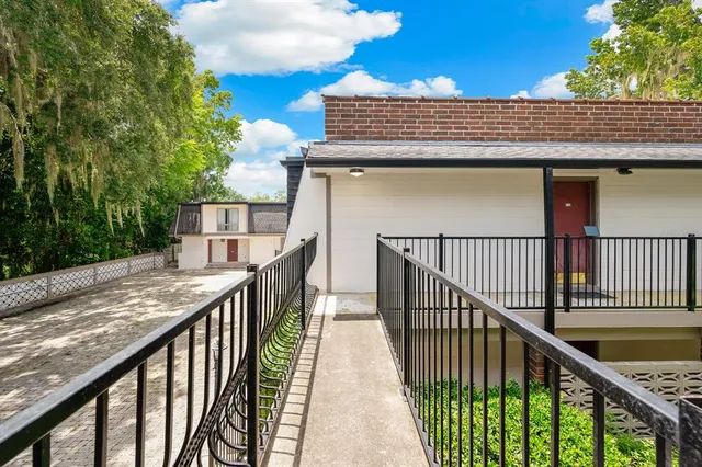 a view of balcony with wooden floor
