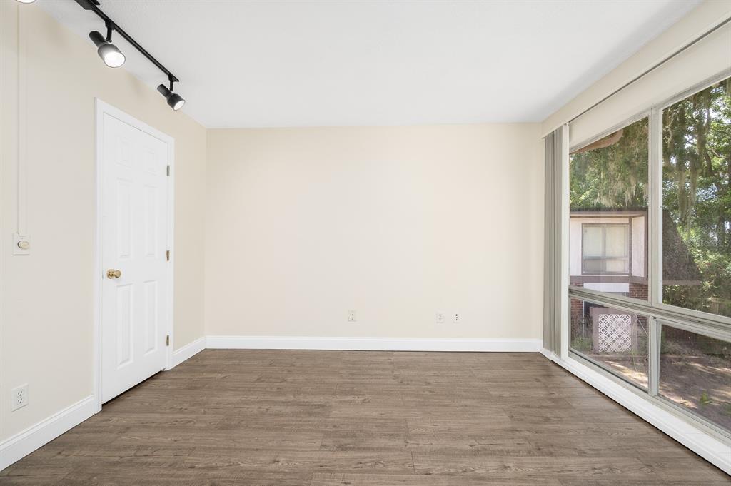 1700 Southwest 16th Court, Unit L26 Gainesville, FL 32608 - Photo 11 of 24 a view of an empty room with a window