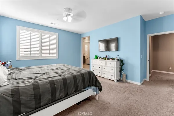 a view of walk in closet with clothes