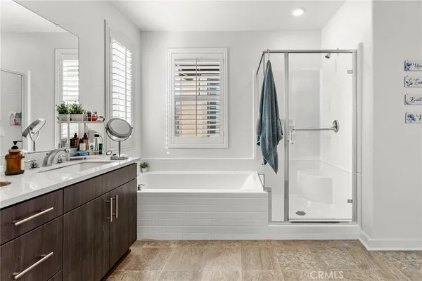 a bathroom with a double vanity sink and mirror