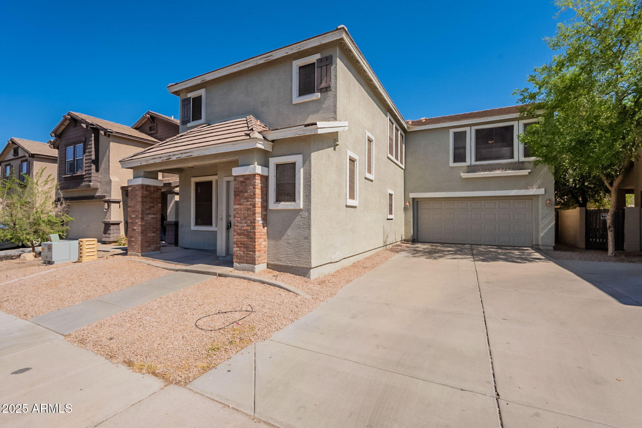 4010 West Fremont Rd. Phoenix, AZ 85041 - Photo 2 of 46 a front view of a house with a garage