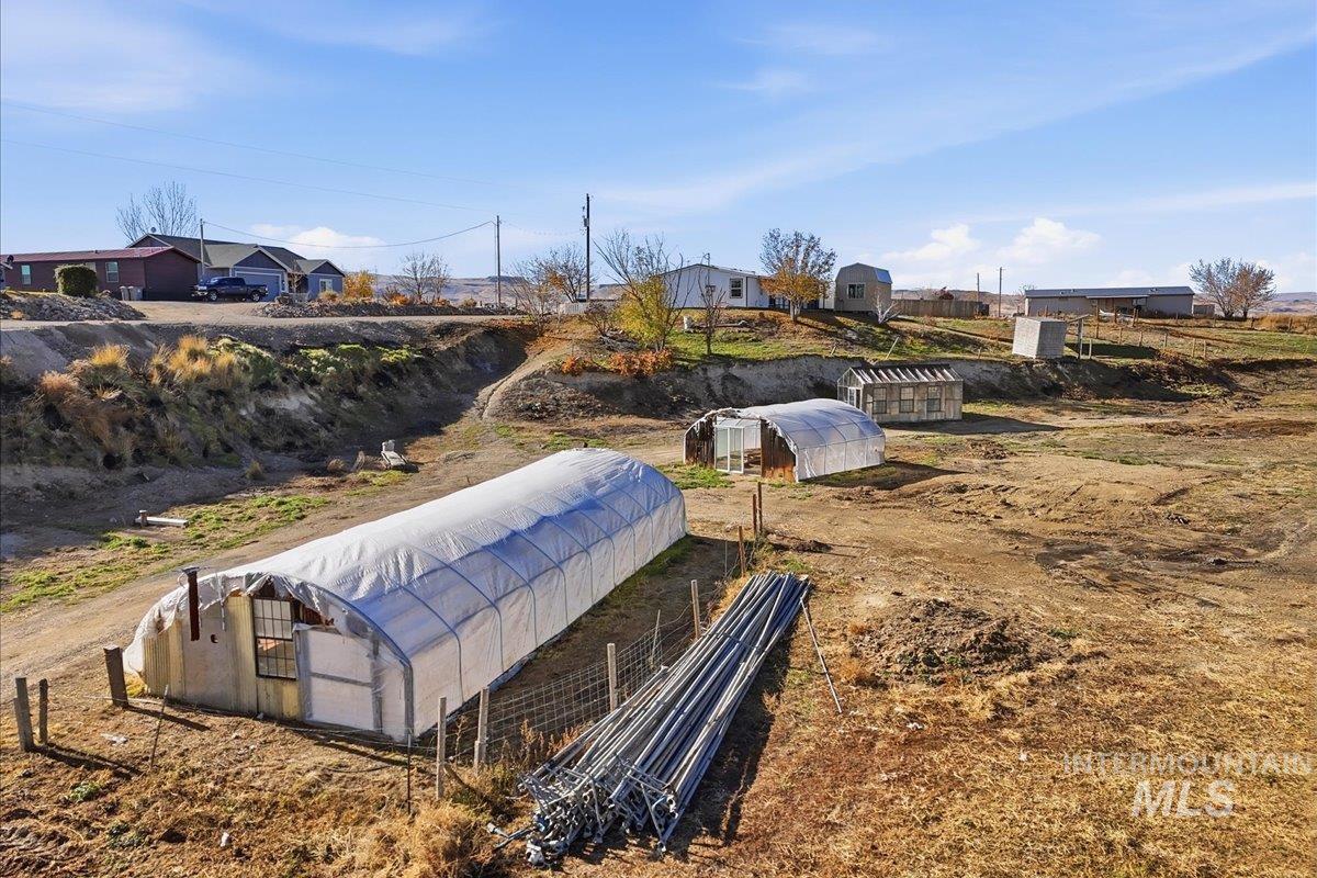 4207 West Pershall Road Marsing, ID 83639 - Photo 13 of 42 View of home's community featuring a greenhouse and an outbuilding