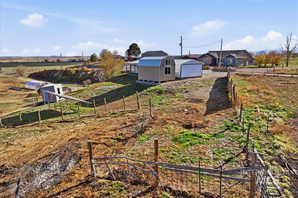 4207 West Pershall Road Marsing, ID 83639 - Photo 15 of 42 View of yard featuring an outdoor structure and a view of countryside