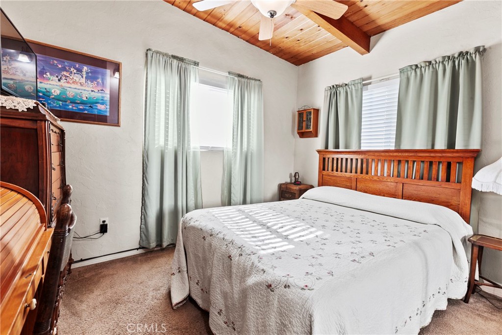 3201 Tide Avenue Morro Bay, CA 93442 - Photo 12 of 30 a bedroom with a bed and a flat screen tv