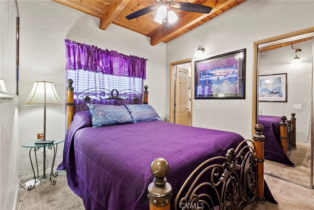 3201 Tide Avenue Morro Bay, CA 93442 - Photo 14 of 30 a bedroom with a bed and a lamp