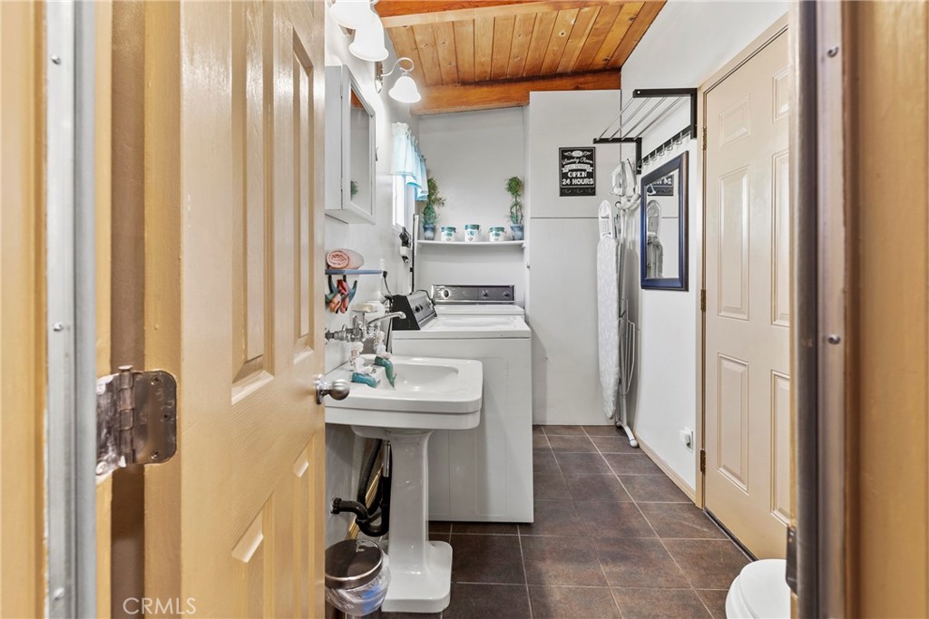 3201 Tide Avenue Morro Bay, CA 93442 - Photo 16 of 30 a hallway with a sink and cabinets