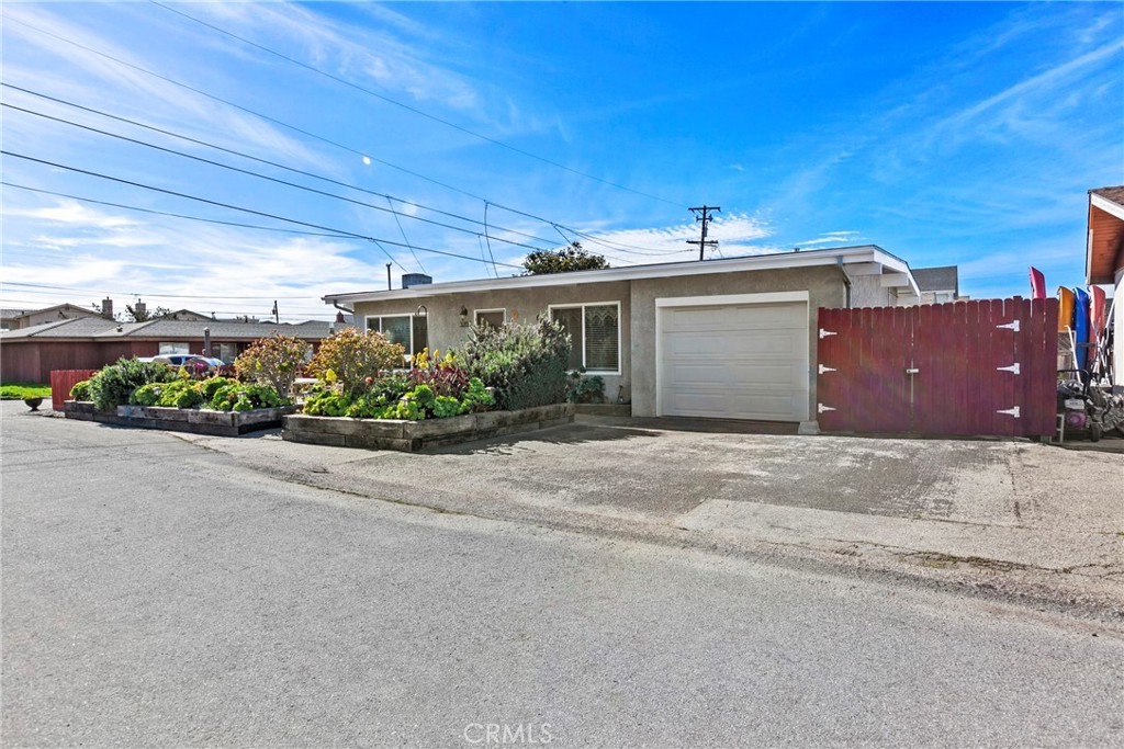 3201 Tide Avenue Morro Bay, CA 93442 - Photo 23 of 30 a view of a house with a yard and potted plants