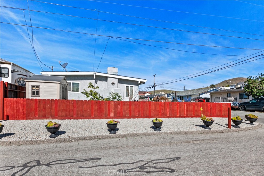3201 Tide Avenue Morro Bay, CA 93442 - Photo 25 of 30 a front view of a house with a basket ball court
