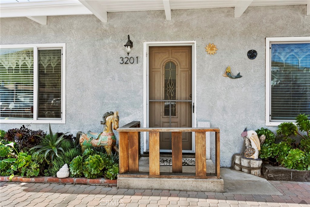 3201 Tide Avenue Morro Bay, CA 93442 - Photo 4 of 30 a front view of a house with garden