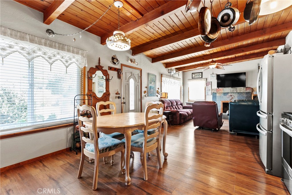 3201 Tide Avenue Morro Bay, CA 93442 - Photo 8 of 30 a view of a dining room with furniture window and wooden floor