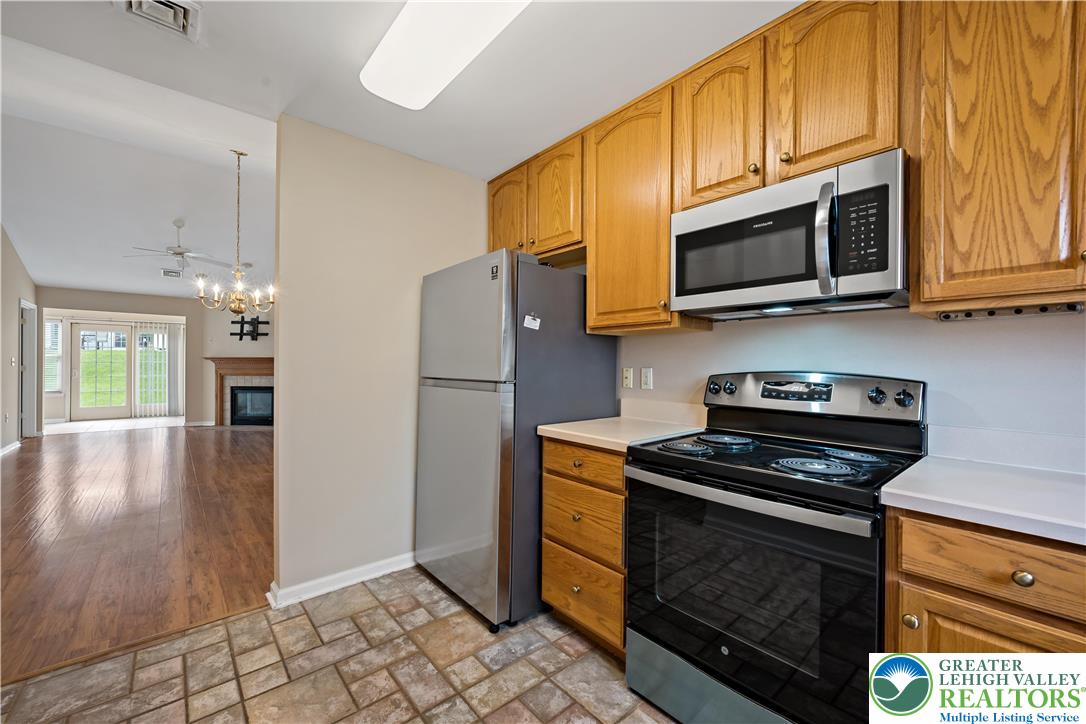 1300 Upstream Farm Road Easton, PA 18040 - Photo 11 of 29 a kitchen with stainless steel appliances granite countertop a stove microwave and refrigerator