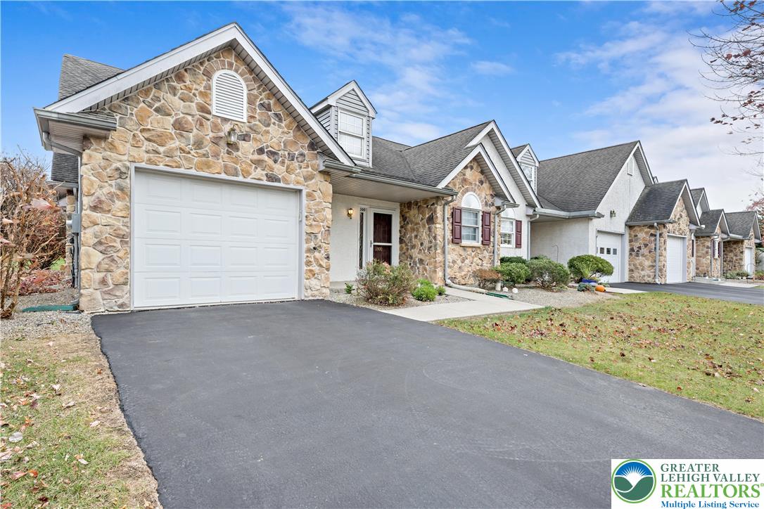 1300 Upstream Farm Road Easton, PA 18040 - Photo 2 of 29 a front view of a house with a yard and garage