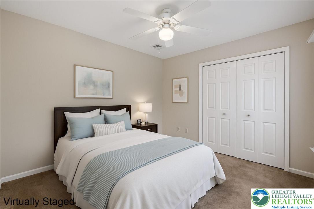 1300 Upstream Farm Road Easton, PA 18040 - Photo 22 of 29 a bedroom with a bed and a chandelier