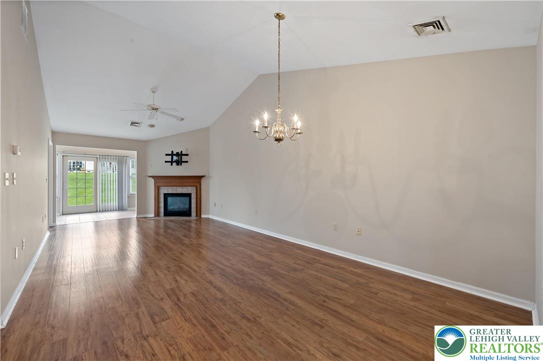 1300 Upstream Farm Road Easton, PA 18040 - Photo 4 of 29 a view of a room with wooden floor and fireplace