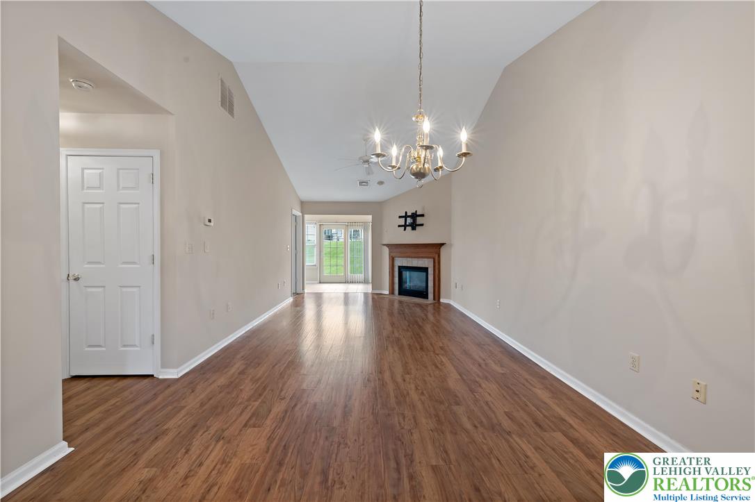 1300 Upstream Farm Road Easton, PA 18040 - Photo 6 of 29 a view of livingroom with window hardwood floor and kitchen view