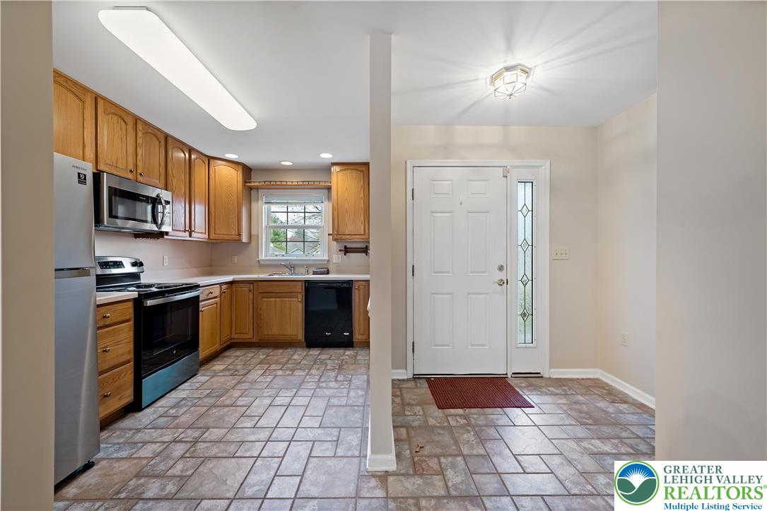 1300 Upstream Farm Road Easton, PA 18040 - Photo 9 of 29 a large kitchen with stainless steel appliances granite countertop a refrigerator and a sink