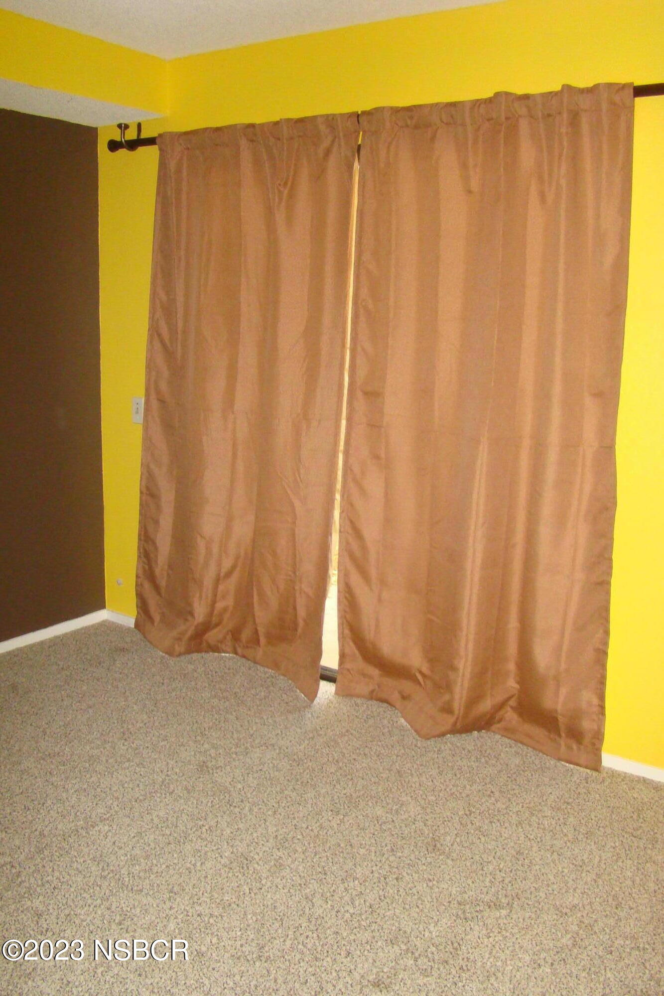 1245 Riverside Drive Lompoc, CA 93436 - Photo 12 of 16 a view of a room with a window and a door