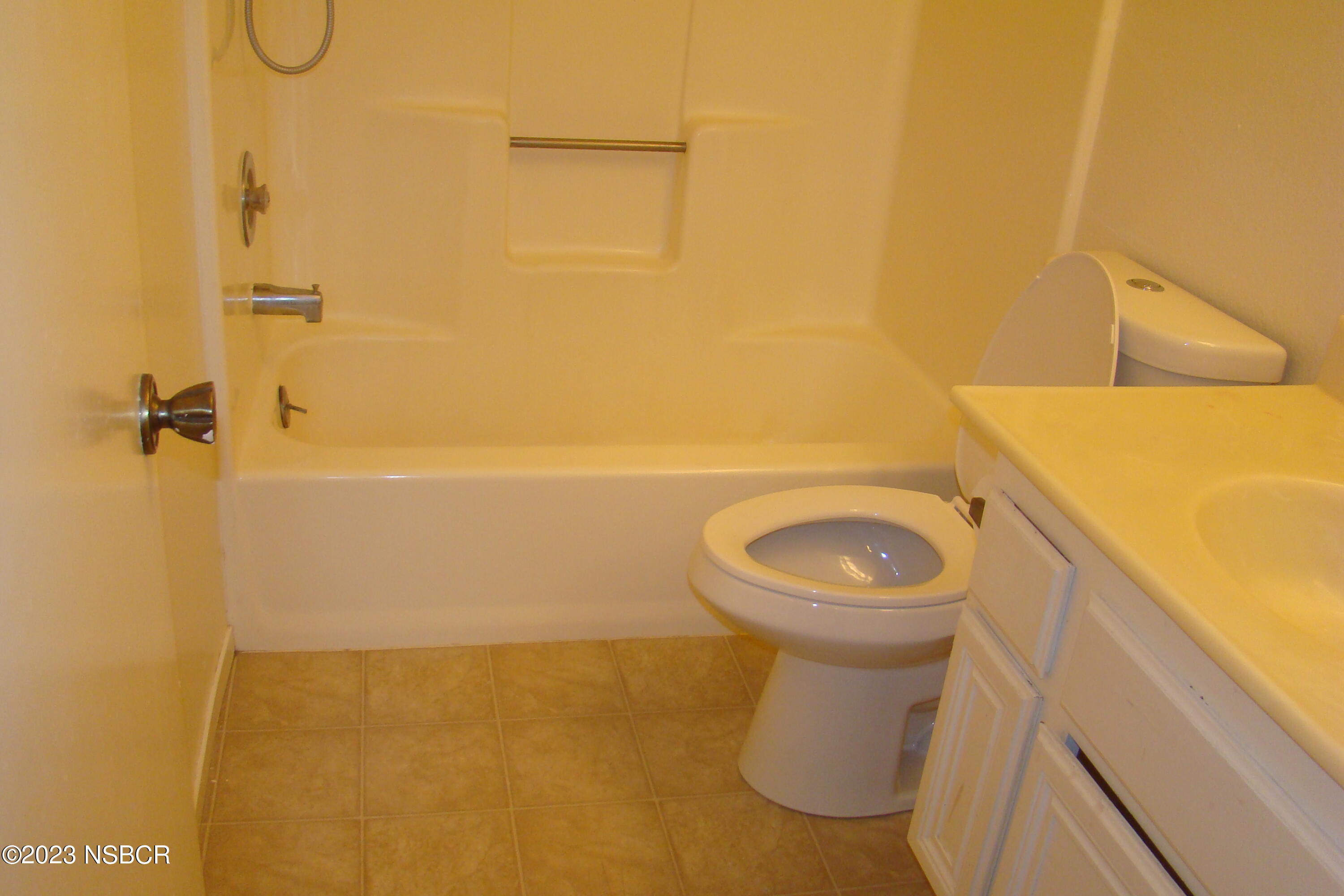 1245 Riverside Drive Lompoc, CA 93436 - Photo 16 of 16 a bathroom with a toilet and a shower