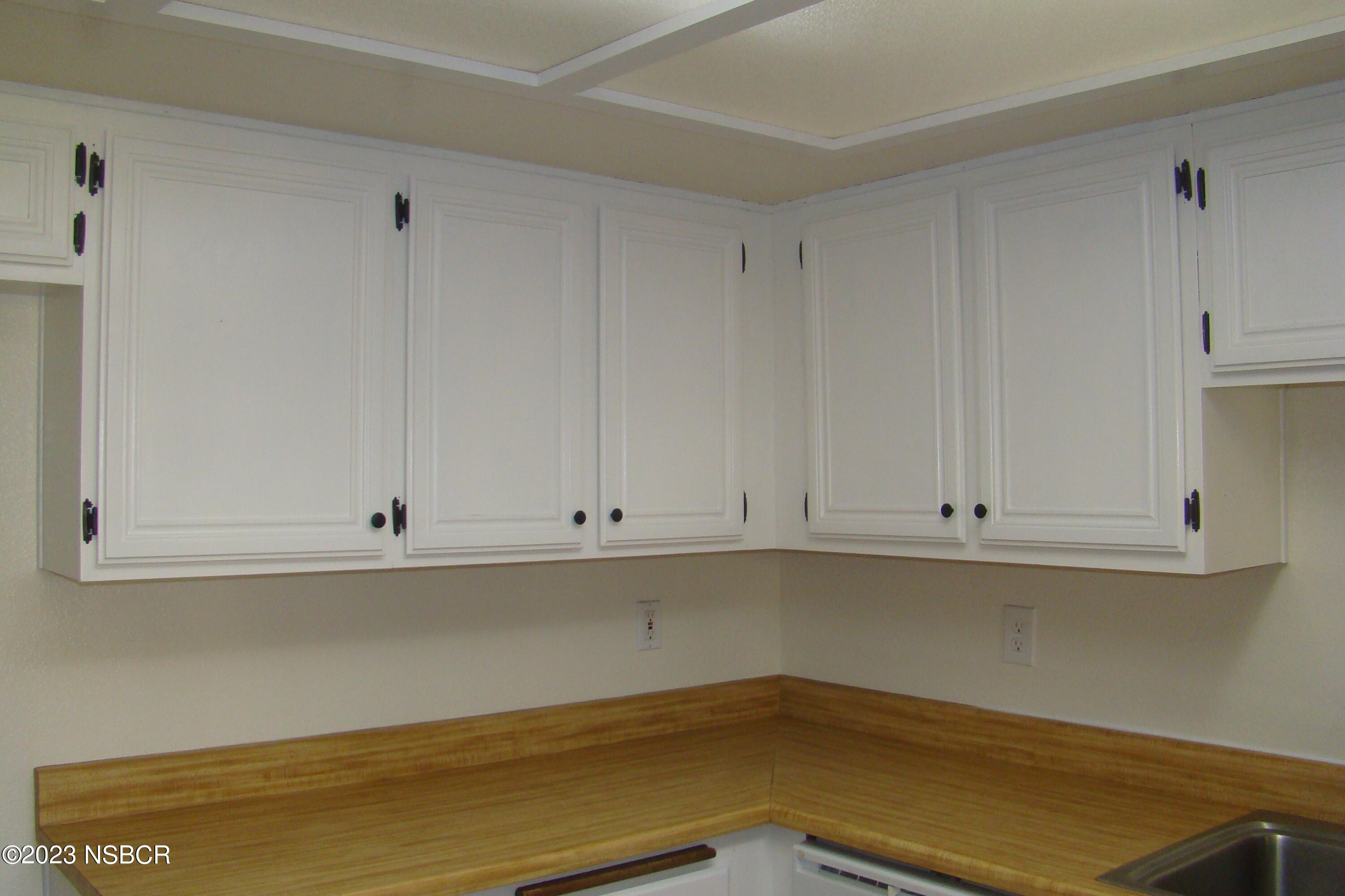 1245 Riverside Drive Lompoc, CA 93436 - Photo 10 of 16 a view of a kitchen cabinets and window