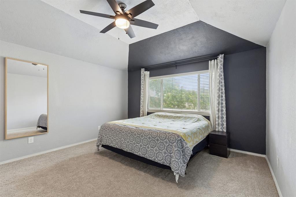 304 Lark Lane Euless, TX 76039 - Photo 6 of 32 a bedroom with a bed and window