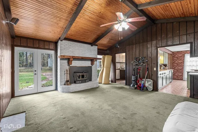 an empty room with painting on the wall