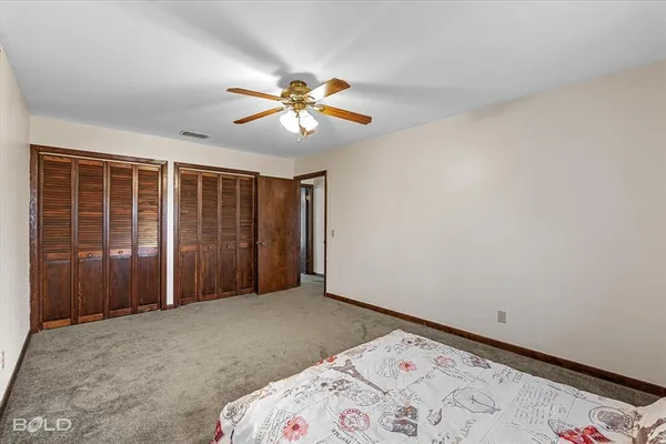 a view of livingroom with a ceiling fan and window