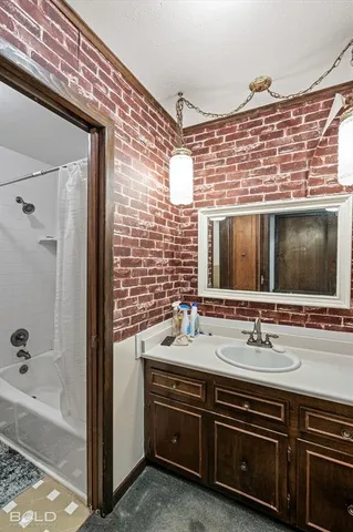 an empty room with fan and windows