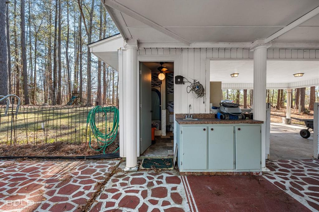 447 Burrow Lane Cotton Valley, LA 71018 - Photo 29 of 39 a kitchen with granite countertop a refrigerator and a sink