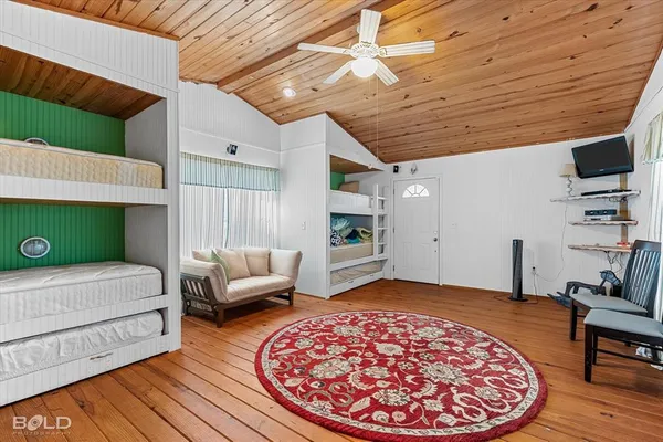 a bedroom with a bed and a couch