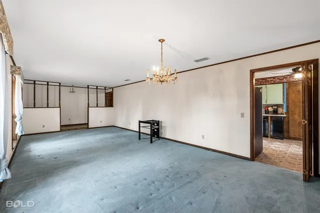 a kitchen that has a sink and a stove in it