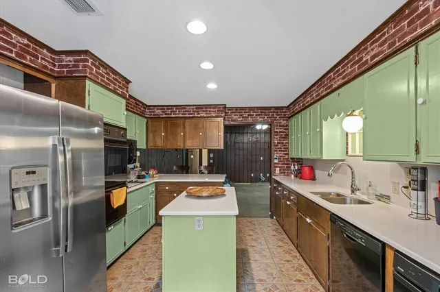 a kitchen with refrigerator and stove