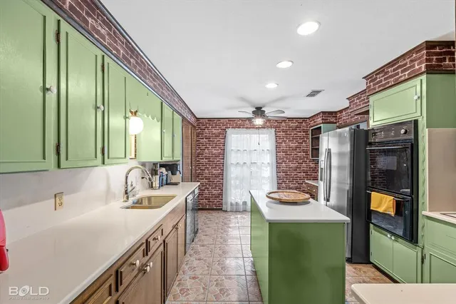 a view of a kitchen with dining table and chairs