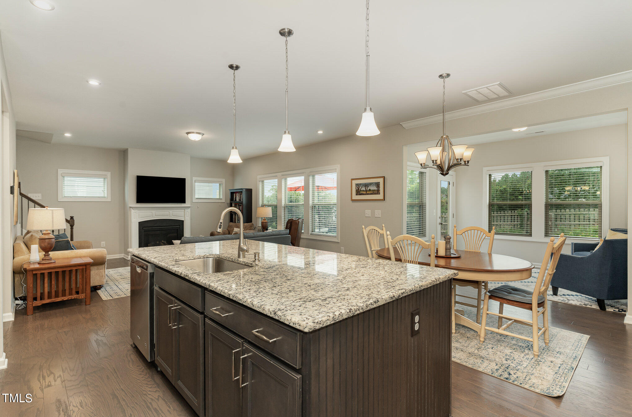3405 Barn Road Apex, NC 27502 - Photo 15 of 38 a open kitchen with a table and chairs in it
